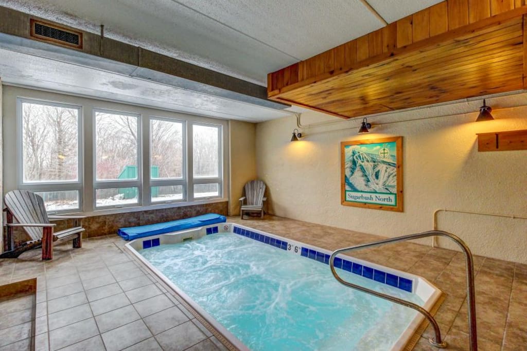 Large shared indoor hot tub for the building, just a short walk down the hall from the apartment