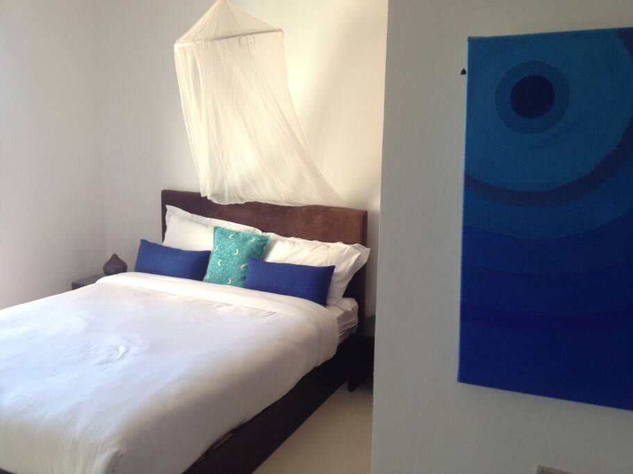 the bedroom fitted wardrobes and adjoining balcony
