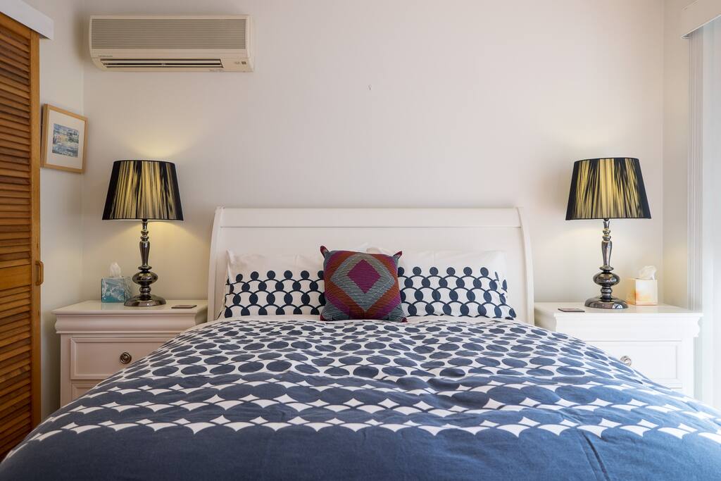 Gorgeous comfy queen size bed in air-conditioned main bedroom with ceiling fan. Walk-in robe.