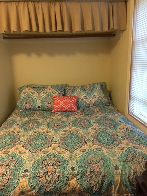 Bed is situated in a private, cozy nook