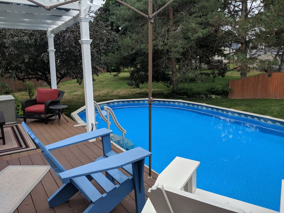 Oval pool with loads of deck space and seating