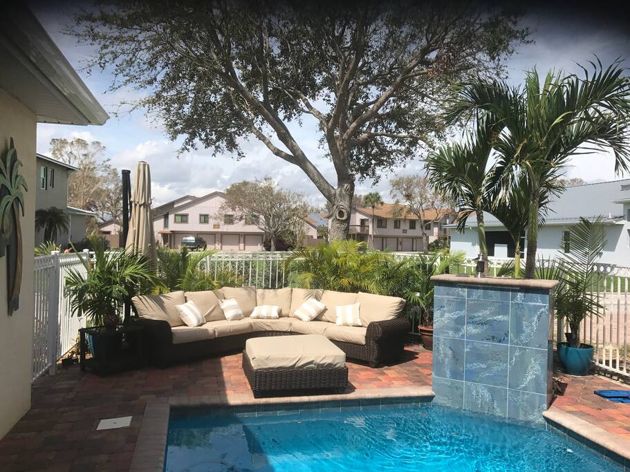 The beautiful patio also has a semi wrap around couch Very comfortably seats 6.