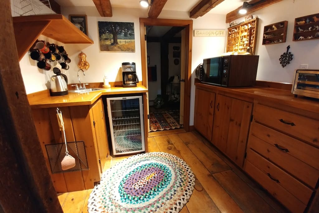 Kitchenette w toaster oven, kettle, beverage fridge, convection/microwave, Keurig coffee maker, dishes, utensils. No stove top.