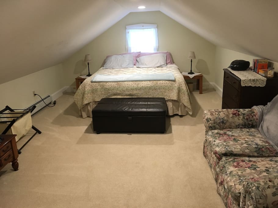 The hassock in front of the king bed folds to a twin bed.