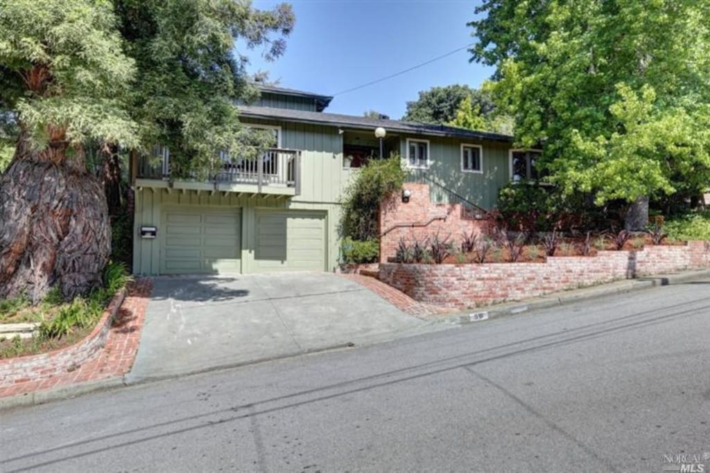 Front of house. Large redwoods adorn west side