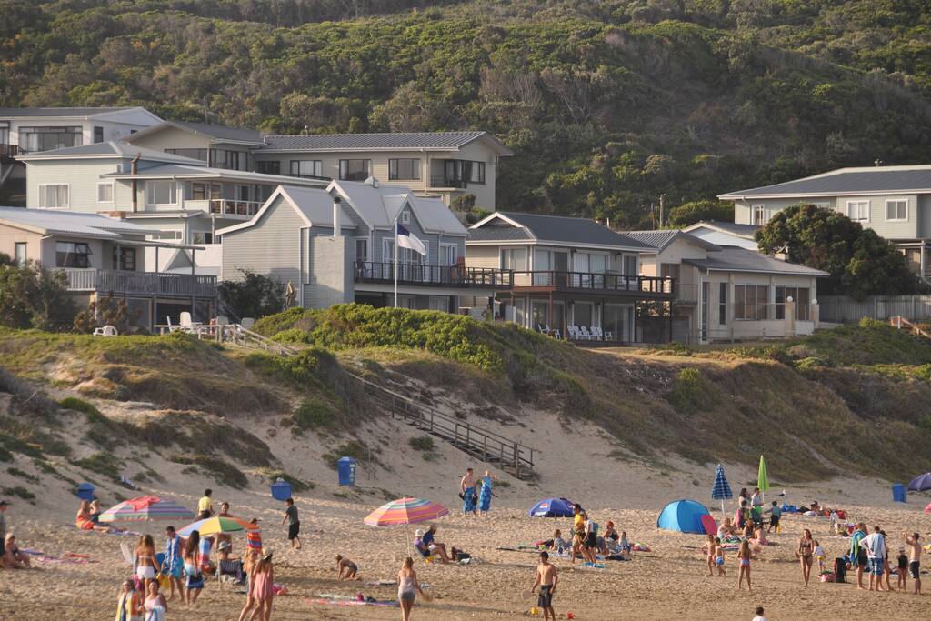 View of the house as seen from the beach (house with the white roof).