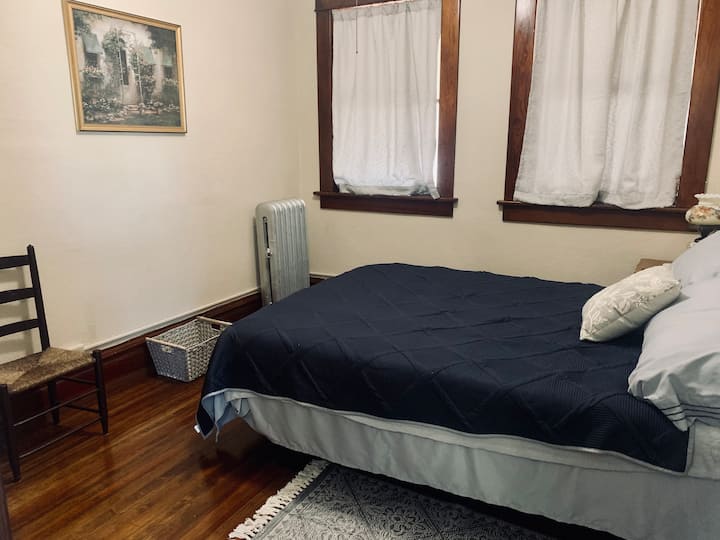 Second bedroom: queen bed and alarm clock with plug-in for a phone charger. 