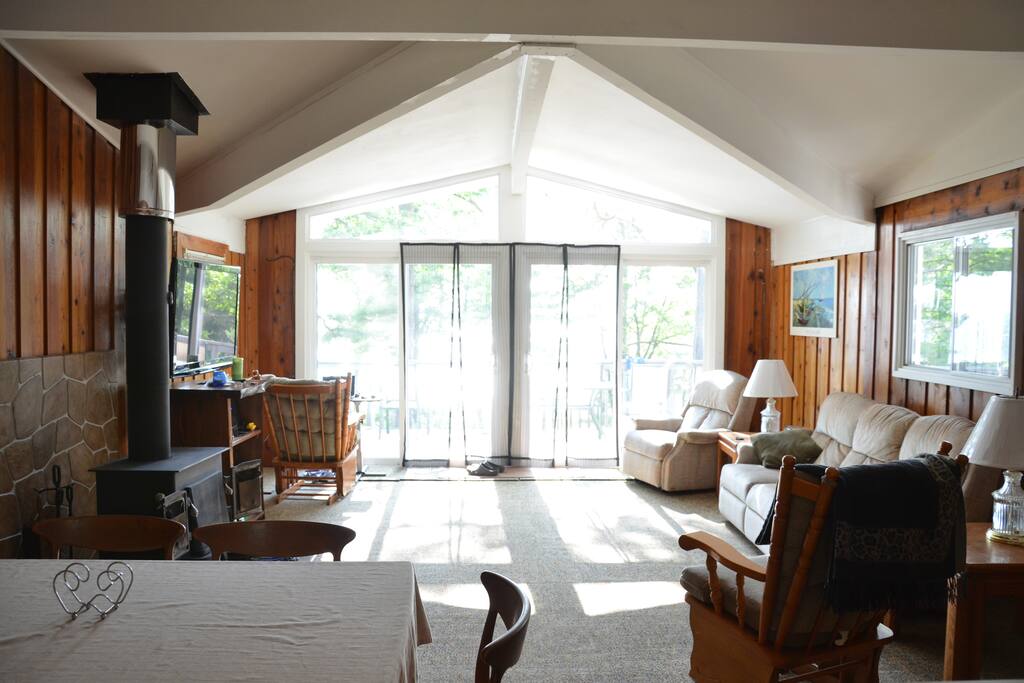 Bright and sunny main living room with pull out foot rest furniture and 2 rooking chair