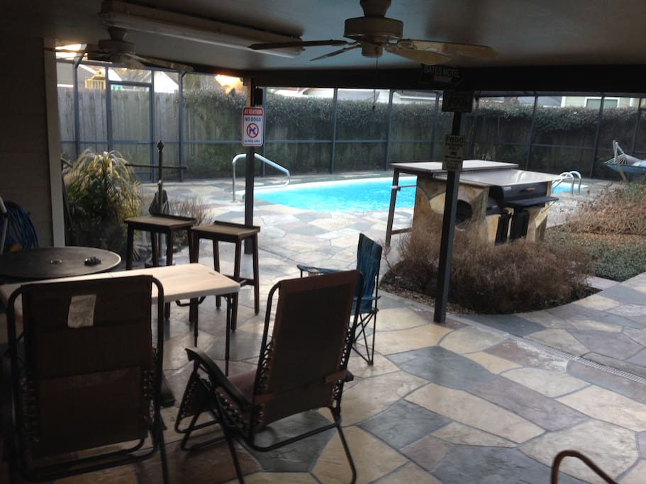 Outdoor covered patio with smoker/BBQ and full screen enclosure