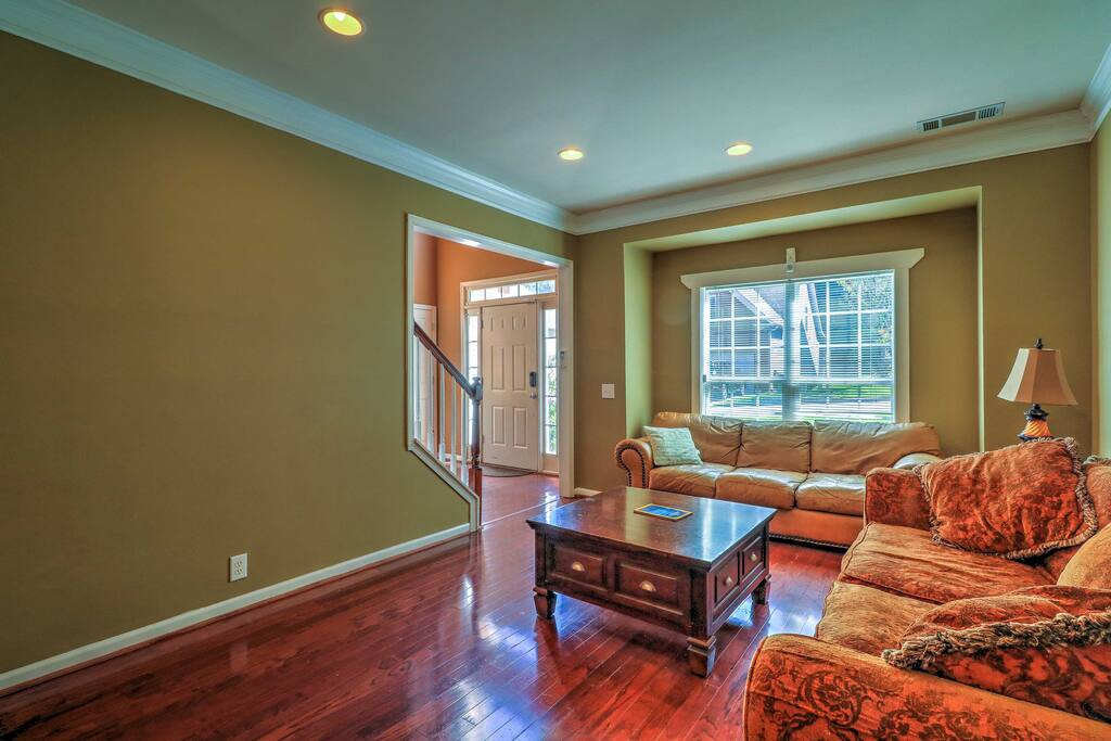 The formal living room opens up to the dining room and is the perfect spot to relax and read a book.