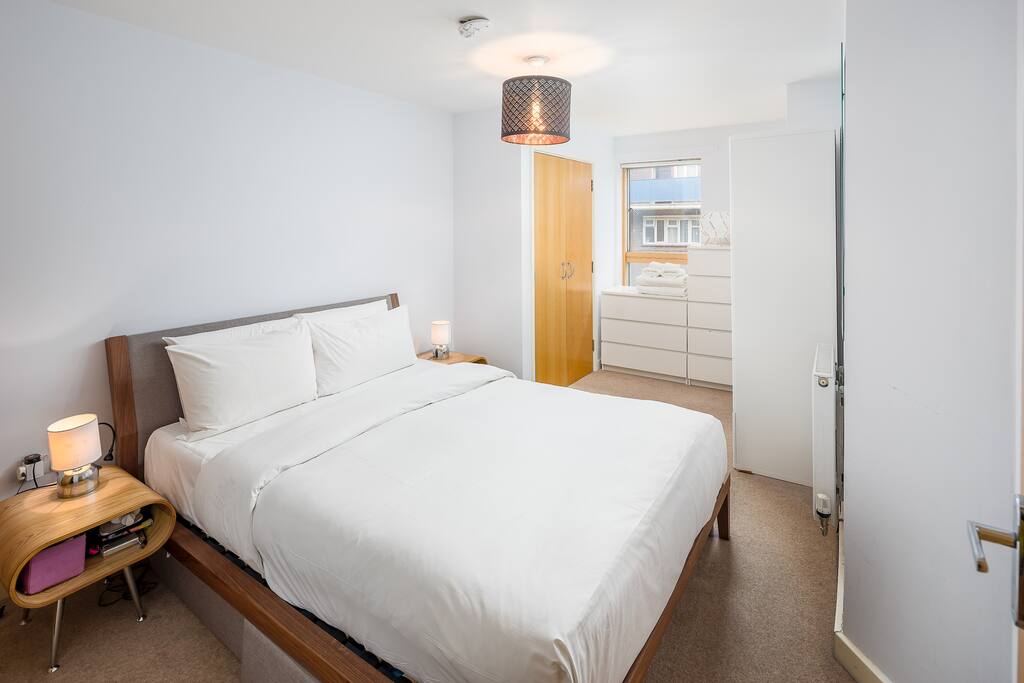 A spacious bedroom with a King-size bed...