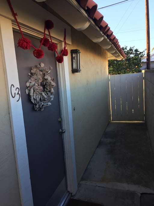 Front door and side gate into the backyard.