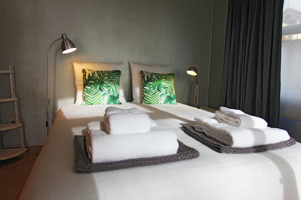 The Bedroom: A comfortable clean bed for two.