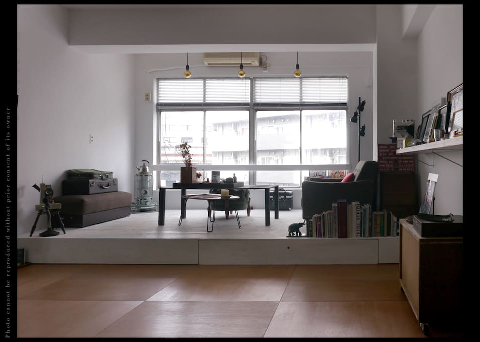 Spacious artists' studio with an elevated salon space.