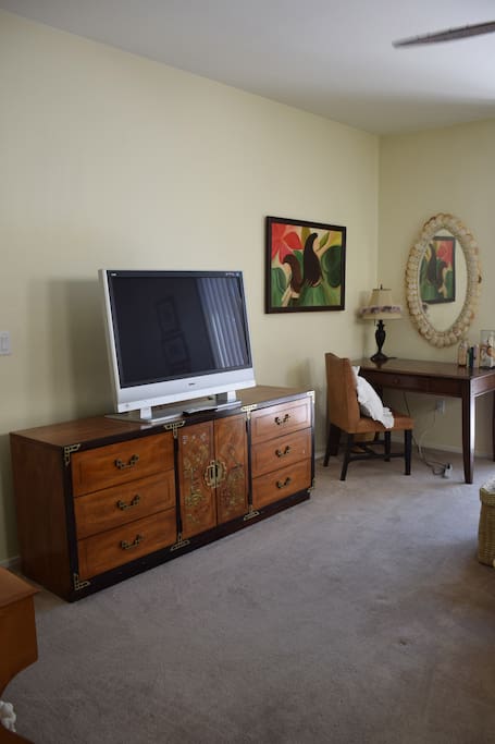 Fully furnished with Asian themed dresser and vintage wooden desk and chair. 40 inch TV with basic cable.