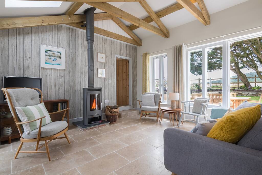 Sitting area with TV and efficient wood-burning stove