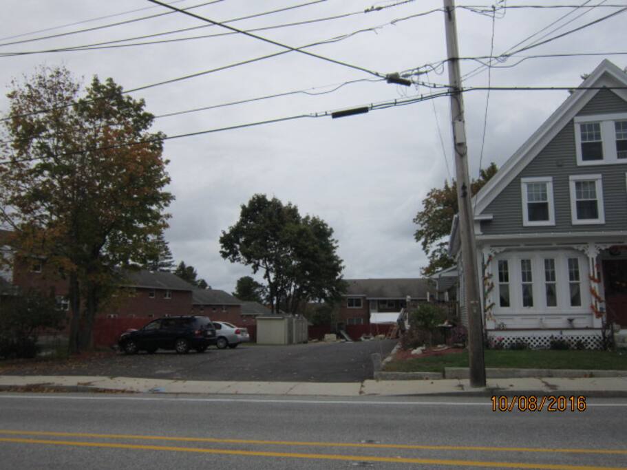 very large driveway and parking area on side of house
