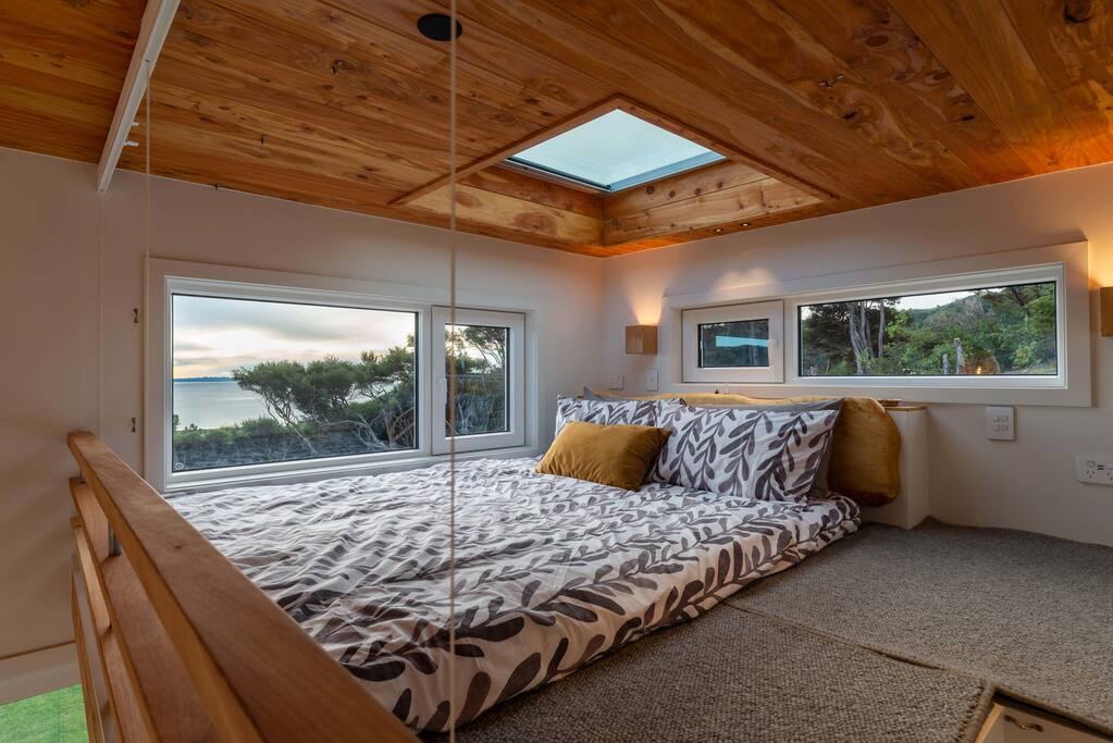 Queen size beds, one with child safety net