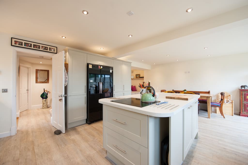 Kitchen with american style fridge freezer and breakfast bar.