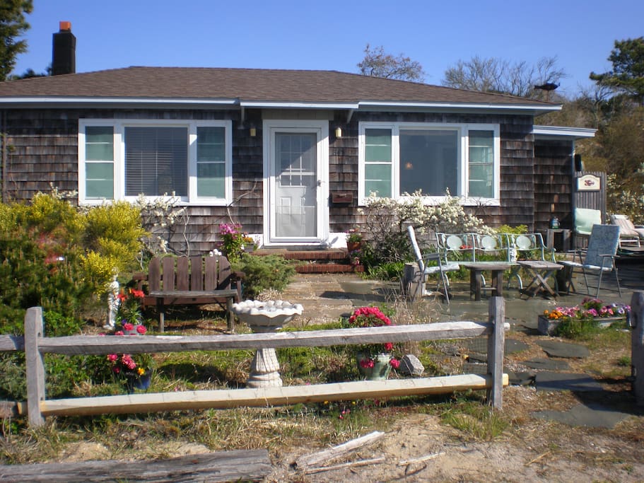 Front of house with lots of flowers