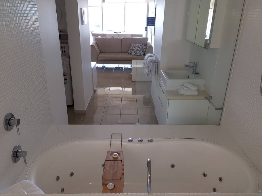 Bathroom has shower over bath tub