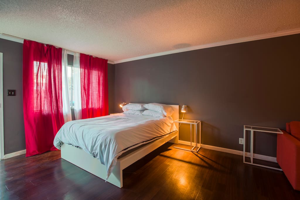 Queen bed with premium mattress. Sconces for the perfect reading light.