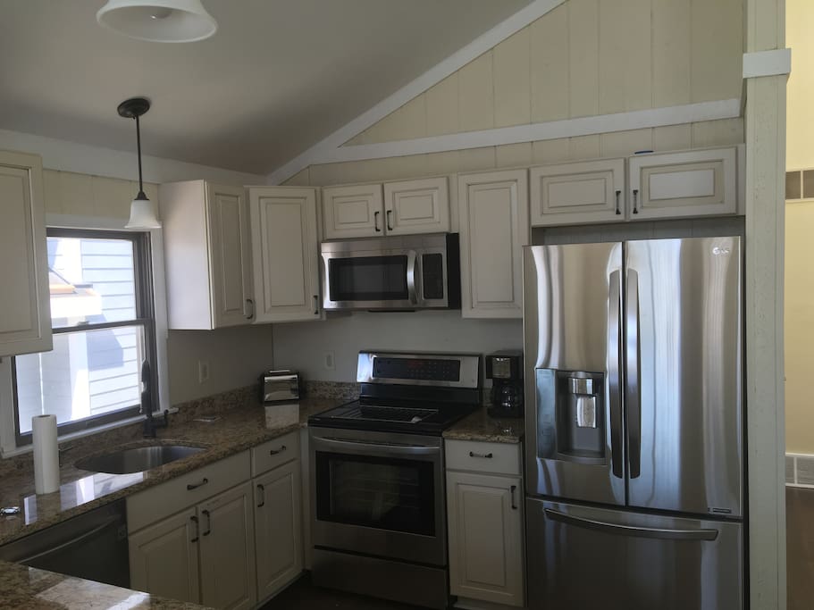 New kitchen, new appliances, hard wood floors and granite counter tops