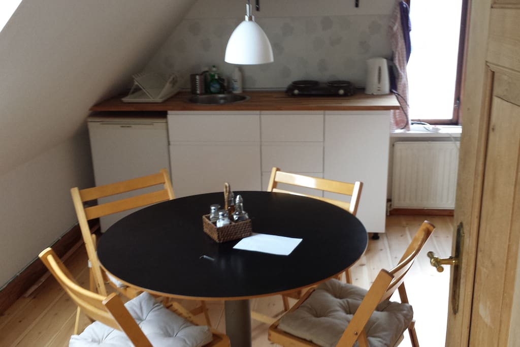 The dining table and the tea kitchen, as seen from the bedroom