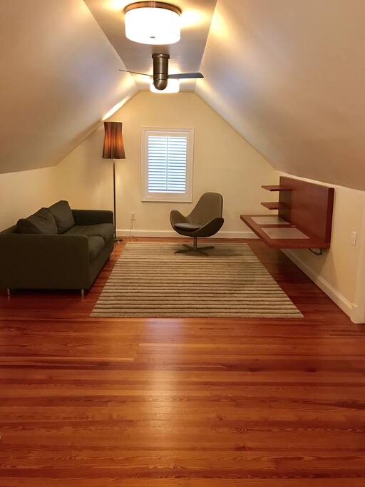 Sleeper sofa and relaxation area in the attic