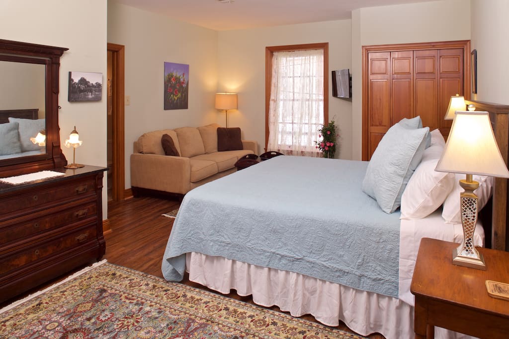 Around the Corner has two bedrooms on the s cond floor -- including this one with a King Bed and sitting area.