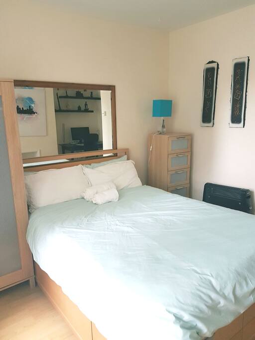 Cupboard and drawer space, bed side table (not shown) and lamp.