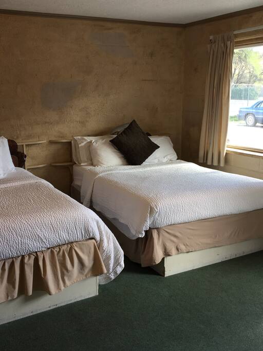 Comfy, Clean, Affordable. This is a smaller, older room but the price is greasy for 4 people.