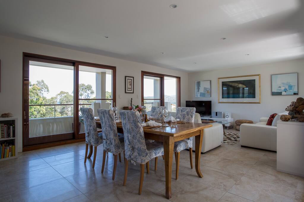 Open plan dining to lounge, balconies front and rear.