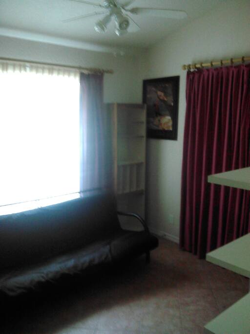 Beautiful natural light! Maroon curtains for privacy.