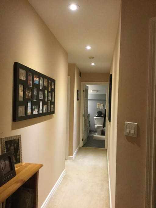Hallway to private bedrooms and private bathrooms