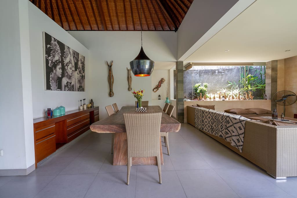 Huge dining area with hand-beaten copper pendant lighting.