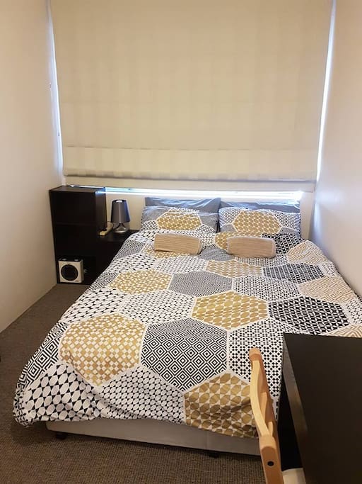 Your private room. Spacious queen sized bed with portable heater and fan.