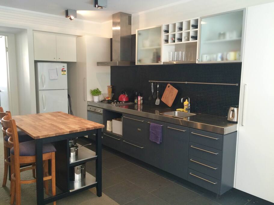 New kitchen with dishwasher (it's hiding the draws), gas stove and new cooking utensils.
