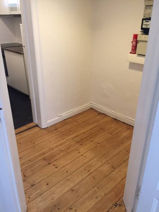 Entrance leading to kitchen, living room and bedroom.