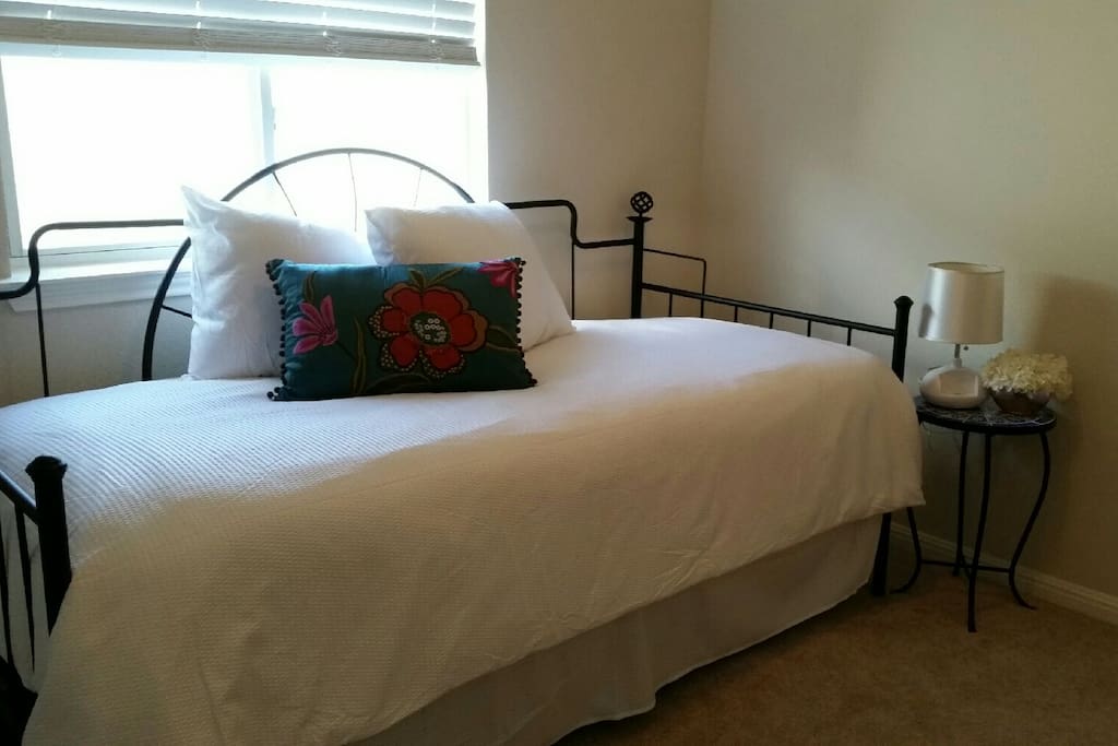 Daybed with additional trundle bed beneath.