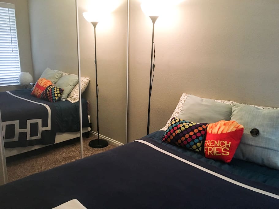 Bed and closet with mirrored doors