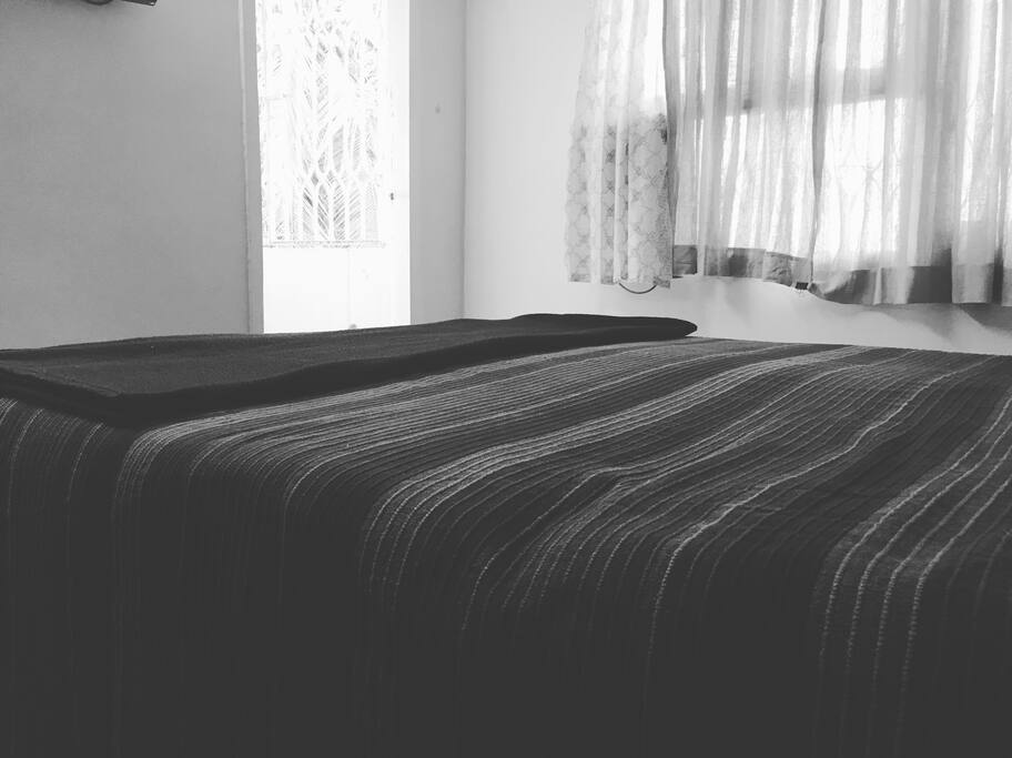 Bedroom with Balcony View