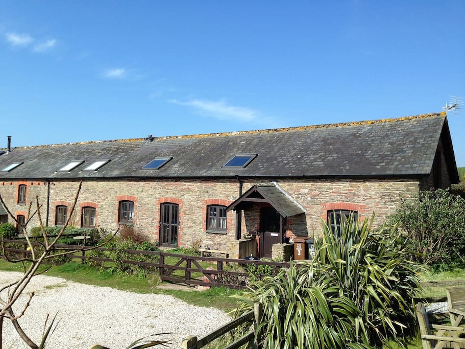 Our spacious family home is one of seven barn conversions, perfectly situated on the south Devon coast for family beach holidays. A little walk to the beach and overlooking the picturesque Avon Estuary, our home is surrounded by glorious coast and countryside just waiting for you to discover.