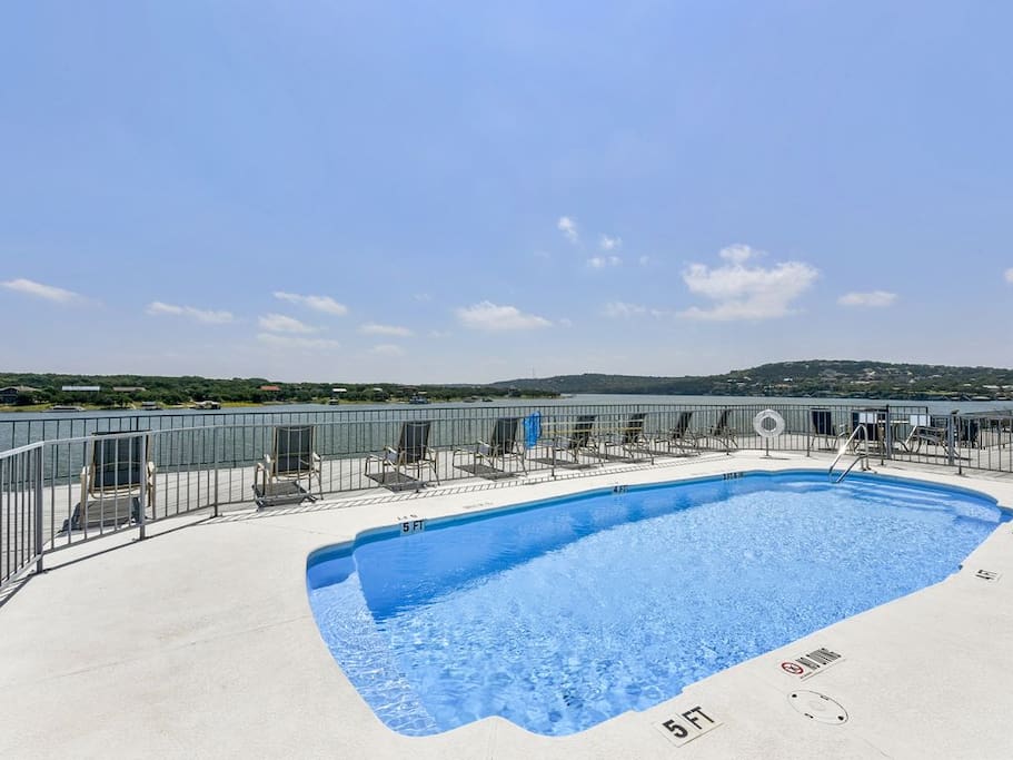 A sparkling swimming pool for your use in the center of this luxury community.