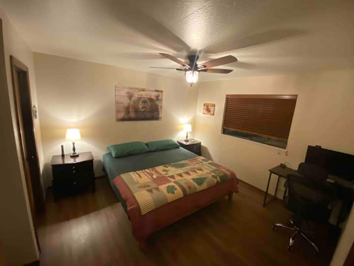 Downstairs bedroom with king size bed, walk in closet with plenty of storage., desk + monitor for "work from cabin". Full length mirror and extra large dog crates available for those crate-trained pups. 