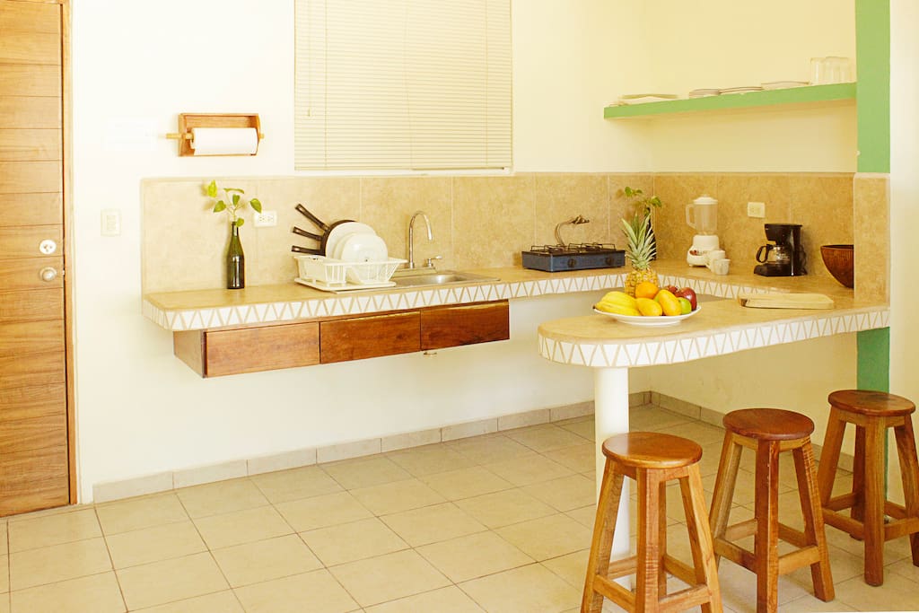 Kitchenette with everything you need for basic cooking. Includes full fridge and drinking water