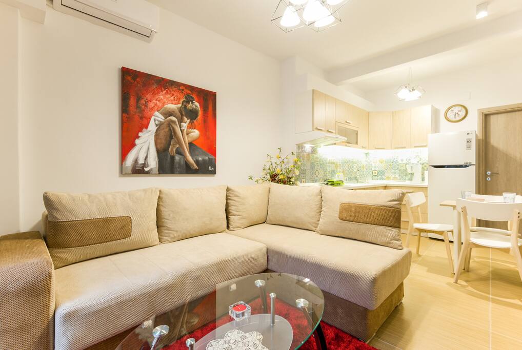 the living room with fully equipped kitchen and dinning corner