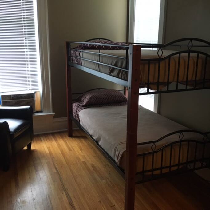 Bunk beds in the same room as the queen bed.