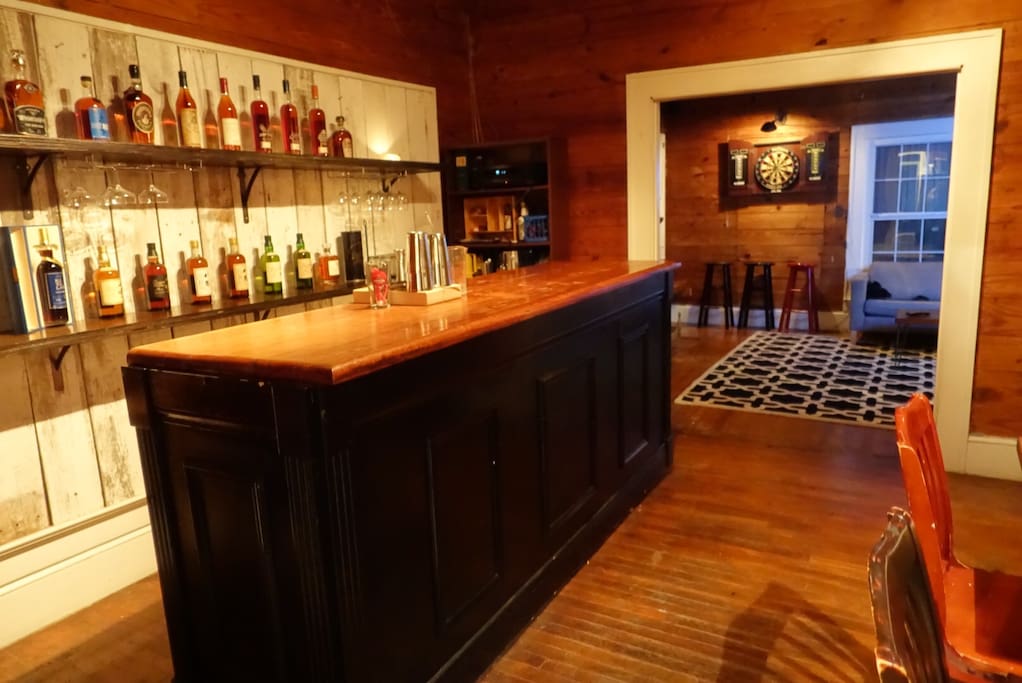 Bar room with 10ft dry bar, refrigeration, surround sound and table seating.