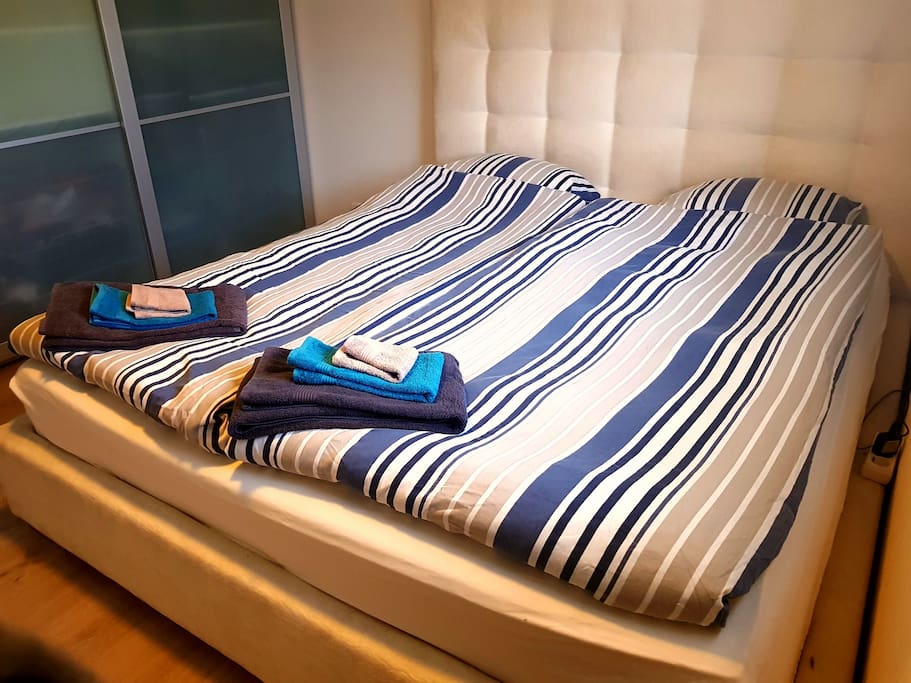 Master bedroom. Large luxury bed. Can be set up with a connected crib or completely enclosed crib.